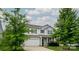 Charming two-story home with attached garage and well-maintained landscaping, set against a bright, cloudy sky at 11109 Pond Valley Ct, Charlotte, NC 28269