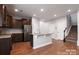 Open kitchen with granite countertops, stainless steel appliances, and a convenient island at 11109 Pond Valley Ct, Charlotte, NC 28269