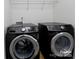 Convenient laundry area featuring modern, matching washer and dryer units at 11109 Pond Valley Ct, Charlotte, NC 28269