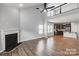 Open-concept living area with fireplace and a kitchen view, perfect for entertaining at 11109 Pond Valley Ct, Charlotte, NC 28269