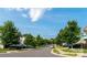 Neighborhood street view featuring well-maintained lawns, mature trees, and parked cars at 11109 Pond Valley Ct, Charlotte, NC 28269