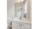 Bright bathroom features a white vanity with modern fixtures and a large mirror at 1126 Dean Hall Ln, Matthews, NC 28105