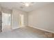 Spacious bedroom features neutral carpet, ceiling fan, and ample natural light at 1126 Dean Hall Ln, Matthews, NC 28105