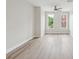 Bright bedroom featuring hardwood floors, with large windows that offers ample natural light at 1126 Dean Hall Ln, Matthews, NC 28105