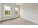 Well-lit bedroom offering neutral walls and two bright windows with beautiful views at 1126 Dean Hall Ln, Matthews, NC 28105