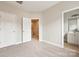 Hallway view with neutral walls and carpet leads to a bathroom at 1126 Dean Hall Ln, Matthews, NC 28105