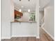 Modern kitchen featuring granite countertops, breakfast bar and stainless steel appliances, blending style and functionality at 1126 Dean Hall Ln, Matthews, NC 28105