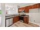 Well-equipped kitchen with stainless steel appliances, granite countertops, and modern finishes for culinary enthusiasts at 1126 Dean Hall Ln, Matthews, NC 28105