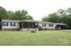 Charming ranch-style home with a covered front porch and carport provides ample parking and curb appeal at 1184 Sherwood Rd, Clover, SC 29710