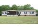 Well-maintained home with a covered porch, a tidy lawn, and inviting curb appeal at 1184 Sherwood Rd, Clover, SC 29710
