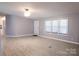 Bright, open-concept living room with hardwood flooring, neutral paint, and ample natural light at 1184 Sherwood Rd, Clover, SC 29710