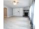 Spacious living room with a stone fireplace, built-in shelving, and light wood-look flooring at 1184 Sherwood Rd, Clover, SC 29710