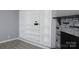 Close-up of living room with a stone fireplace and custom-built white shelving at 1184 Sherwood Rd, Clover, SC 29710