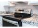 Stainless steel oven, cooktop, and granite countertops are shown in this kitchen view at 1184 Sherwood Rd, Clover, SC 29710