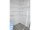 A well-lit pantry with wood-look flooring and wire shelving is shown in this image at 1184 Sherwood Rd, Clover, SC 29710