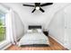 Charming bedroom features wood floors, a large window, and sloped ceilings at 12504 Culp Rd, Gold Hill, NC 28071