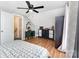 Bright bedroom featuring hardwood floors, sloped ceiling, and ample space at 12504 Culp Rd, Gold Hill, NC 28071