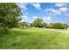 A large, well-maintained grassy lot leading to a charming farmhouse-style house at 12504 Culp Rd, Gold Hill, NC 28071