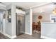 View of kitchen with stainless steel refrigerator, white cabinets, open dining area and decor at 12504 Culp Rd, Gold Hill, NC 28071