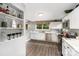 Bright kitchen features white cabinets, stainless steel appliances, modern countertops, and stylish decor at 12504 Culp Rd, Gold Hill, NC 28071