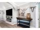 Living room features a stylish console table, a built-in fireplace and entertainment center at 12504 Culp Rd, Gold Hill, NC 28071