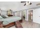 Bright main bedroom with wood floors, en suite access, and a ceiling fan at 12504 Culp Rd, Gold Hill, NC 28071