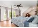 Large main bedroom featuring a four-poster bed, hardwood floors, and lots of natural light at 12504 Culp Rd, Gold Hill, NC 28071