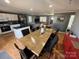 Open floor plan featuring a dining room connecting to the kitchen and living room at 132 Marina Ln, Mooresville, NC 28117