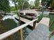 Boat dock featuring a covered boat and slips on a lake setting at 132 Marina Ln, Mooresville, NC 28117