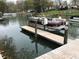 Image showcasing a pontoon boat docked on a serene lake setting at 132 Marina Ln, Mooresville, NC 28117