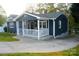 Charming home with a welcoming front porch, white railing, and a curved walkway at 132 Marina Ln, Mooresville, NC 28117
