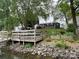 Scenic waterfront property with a private dock and beautifully landscaped backyard at 132 Marina Ln, Mooresville, NC 28117