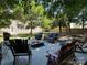 Inviting backyard patio area with ample seating and lush greenery at 14413 Lake Crossing Dr, Charlotte, NC 28278