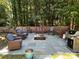 Spacious backyard patio with comfortable seating and a built-in fire pit and grill at 14413 Lake Crossing Dr, Charlotte, NC 28278