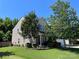 Charming two-story home with a well-manicured lawn and mature landscaping at 14413 Lake Crossing Dr, Charlotte, NC 28278