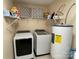 Laundry room featuring a washer, dryer, and water heater at 14413 Lake Crossing Dr, Charlotte, NC 28278