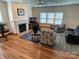 Living room boasts a fireplace, cozy seating, and a view of the backyard at 14413 Lake Crossing Dr, Charlotte, NC 28278