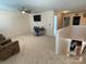 This home's loft includes ceiling fan, stairs, desk, TV, and multiple doorways at 14413 Lake Crossing Dr, Charlotte, NC 28278