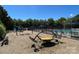 Community playground with various play structures and swings, perfect for Gathering fun and activity at 14413 Lake Crossing Dr, Charlotte, NC 28278