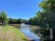 Picturesque pond with fountain and park benches, creating a peaceful community space at 14413 Lake Crossing Dr, Charlotte, NC 28278