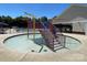 Community splash pad area with colorful water features and a pool in the background at 14413 Lake Crossing Dr, Charlotte, NC 28278