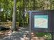 Scenic view of community walking trail with wooden bridge, perfect for outdoor recreation at 14413 Lake Crossing Dr, Charlotte, NC 28278
