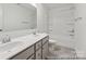 Bathroom with double sink vanity, tiled floors, and a shower-tub combination at 148 Tangle River Dr # 67, Statesville, NC 28677