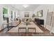 Bright living room featuring neutral furniture, modern decor, and hardwood floors at 148 Tangle River Dr # 67, Statesville, NC 28677