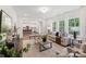 Open-concept living area with hardwood floors, neutral furniture, and lots of natural light at 148 Tangle River Dr # 67, Statesville, NC 28677