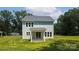 Exterior of home with a grassy backyard and patio area at 1645 Carolina Cir, Gastonia, NC 28054