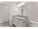 Well-lit bathroom featuring granite countertops, white cabinetry, and a large mirror above the sink at 1645 Carolina Cir, Gastonia, NC 28054