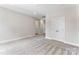 Large bedroom with plush carpeting and neutral walls, next to an open doorway and a double-door closet at 1645 Carolina Cir, Gastonia, NC 28054