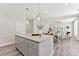 Stylish kitchen island with a granite countertop and seating, open to the dining and living areas at 1645 Carolina Cir, Gastonia, NC 28054