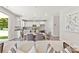 Open living space with a view of the modern kitchen and dining area, featuring neutral tones and contemporary decor at 1645 Carolina Cir, Gastonia, NC 28054